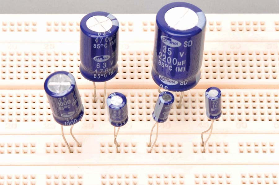 Through-Hole Capacitor for Physics Experiments